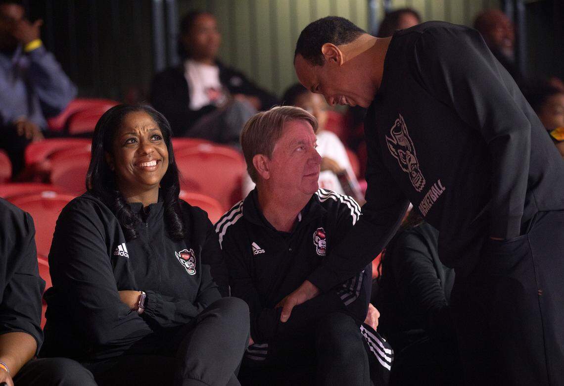N.C. State men’s basketball head coach Kevin Keatts, right, has a word with women’s basketball head coach Wes Moore during the Primetime with the Pack preseason event on Friday, Oct. 25, 2024, at Reynolds Coliseum in Raleigh, N.C.