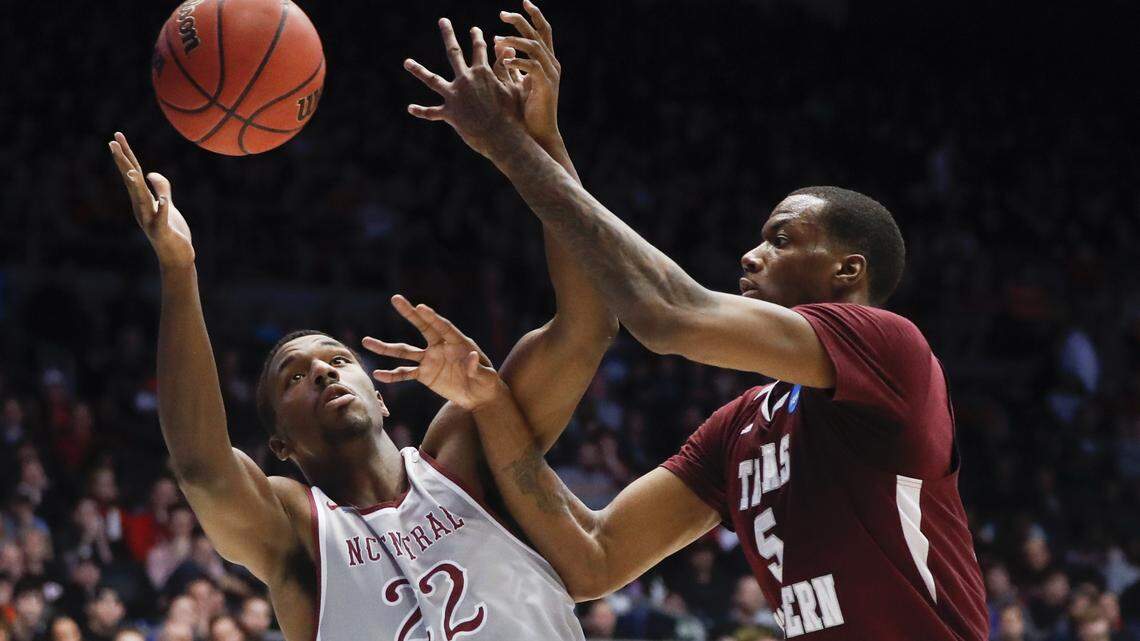 North Carolina Central's Dominique Reid (22) and Texas Southern's Trayvon Reed (5) battle for a rebound during the second half.