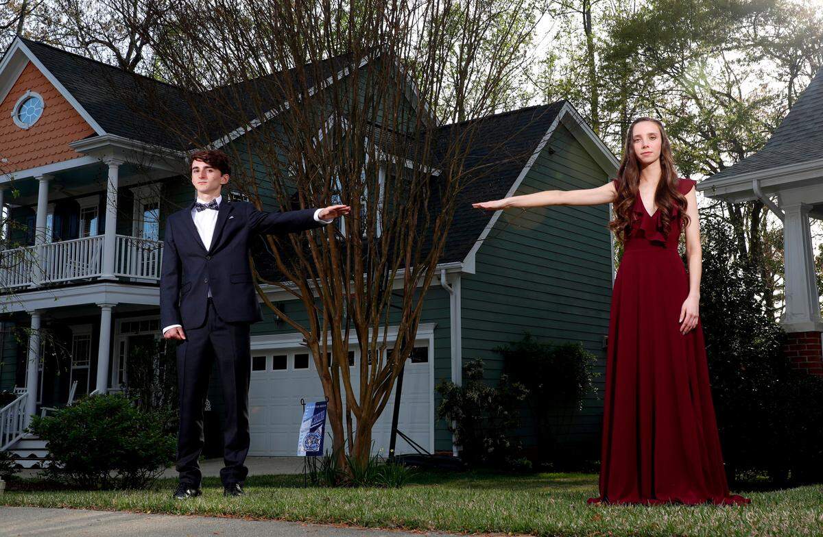 Cameron Clowes, senior, Apex Friendship High School and Sadie Amato, senior, Apex Friendship High School, photographed Monday, March 30, 2020. The seniors are dating and live next to each other.