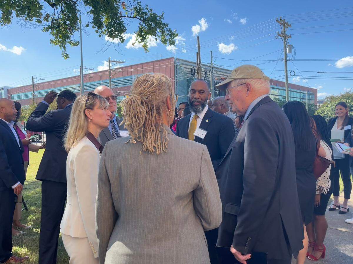 Dominique Blom, General Deputy Assistant Secretary for Public and Indian Housing, (left to right) speaks with Durham Mayor Elaine O’Neal, Durham Housing Authority CEO Anthony Scott and U.S. Rep. David Price at an event celebrating a $40 million grant for redeveloping 519 E. Main and Liberty Street Apartments, on Monday, Sept. 26, 2022.