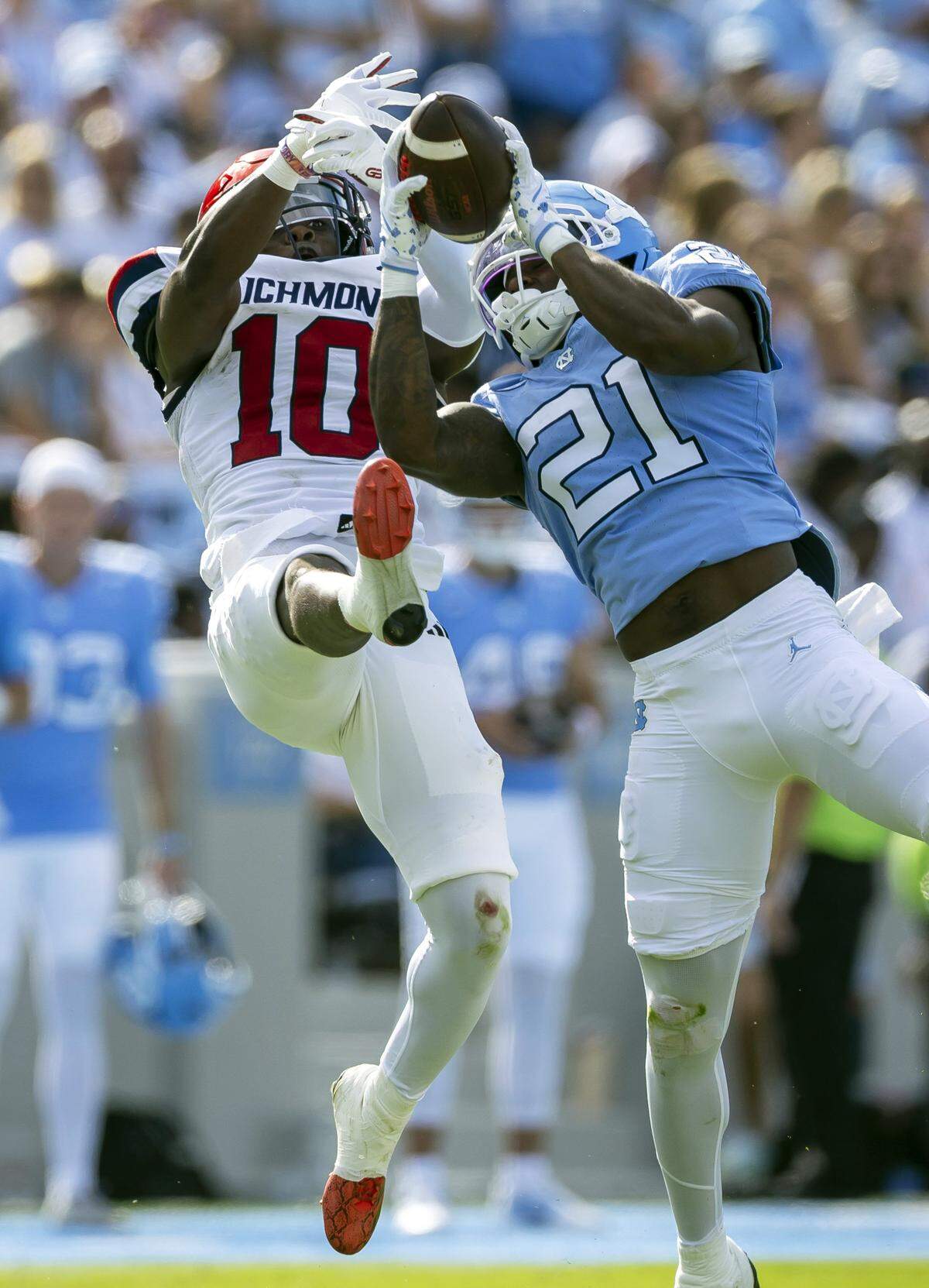 North Carolina defensive back Kaleb Cost (21) is called for pass interference as he picks of a pass intended for Richmond wide receiver Isiah Dawson (10) in the second quarter on Saturday, September 13, 2025 at Kenan Stadium in Chapel Hill, N.C.