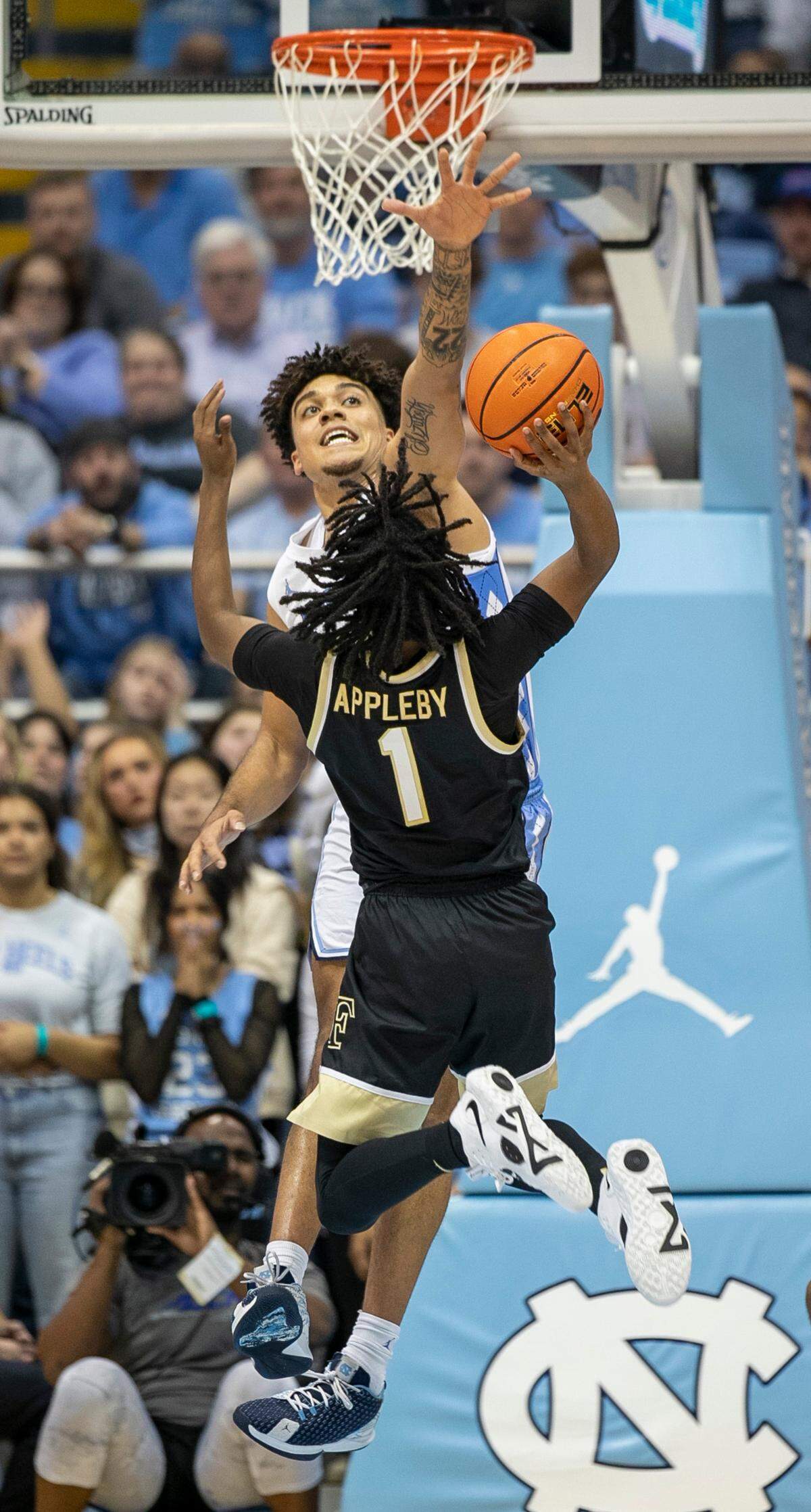 North Carolina’s Justin McKoy (22) blocks a shot by Wake Forest’s Tyree Appleby (1) in the first half on Wednesday, January 4, 2023 at the Smith Center in Chapel Hill, N.C.