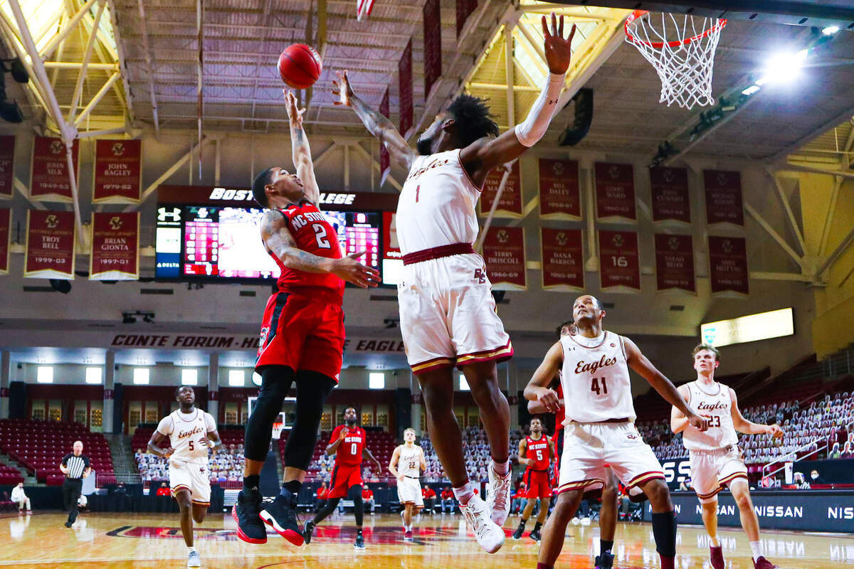 N.C. State’s Shakeel Moore drives against Boston College defender CJ Felder in first half action Feb. 6, 2021.