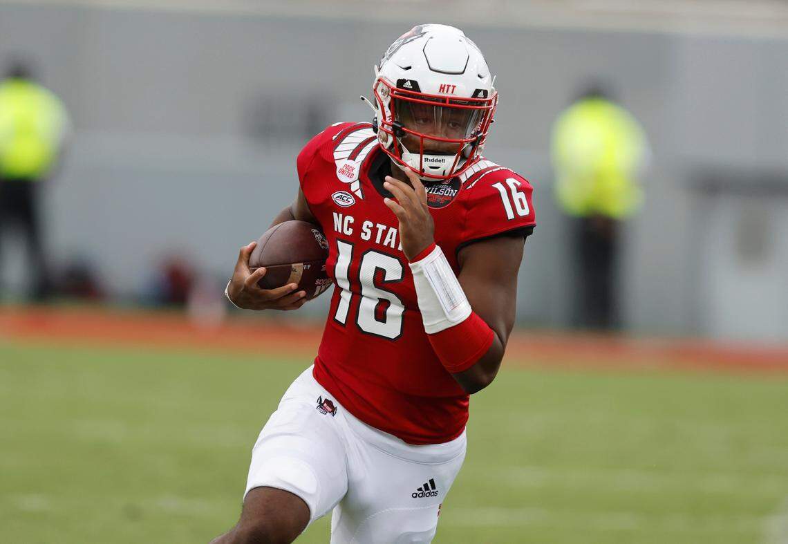N.C. State quarterback MJ Morris (16) scrambles for yards during the second half of N.C. State’s 55-3 victory over Charleston Southern at Carter-Finley Stadium in Raleigh, N.C., Saturday, Sept. 10, 2022.