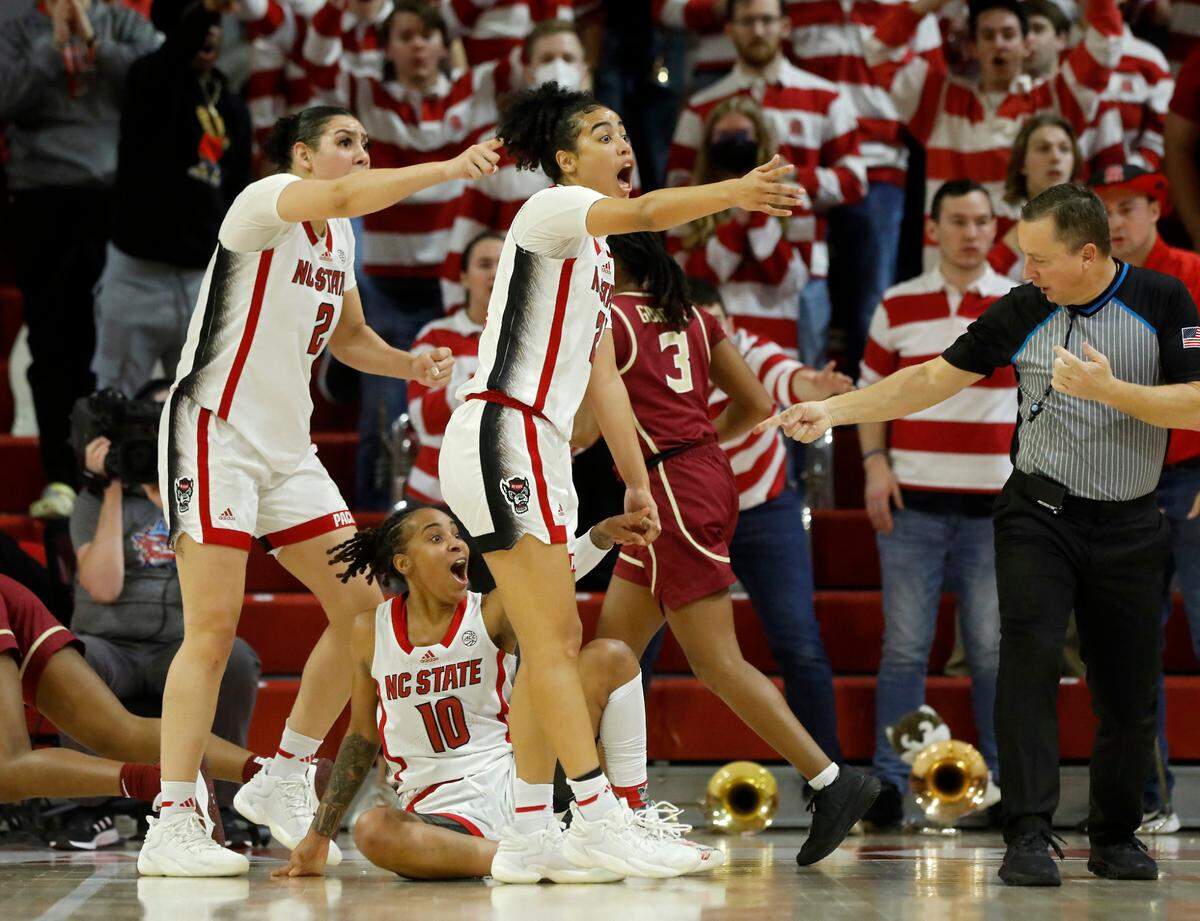 N.C. State’s Mimi Collins, Aziaha James and Madison Hayes react to a call by an official during overtime of the Wolfpack’s 88-80 win over Florida State on Thursday, Jan. 4, 2023, at Reynolds Coliseum in Raleigh, N.C.