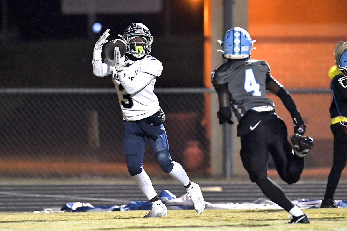 Heritage running back LaDainian Person (3) makes the catch in the end zone for the touchdown ahead of Cleveland’s Josh Booth (4) during the first half. The Cleveland Rams and the Heritage Huskies met in the first round of the NCHSAA 4A playoffs in Clayton, N.C. on November 15, 2024.