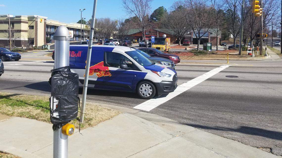 The pedestrian crossing signs are covered up at the intersection of South Saunders Street and Carolina Pines Avenue on Feb. 7, 2019. Carolina Pines turns into Pecan Street across Saunders.