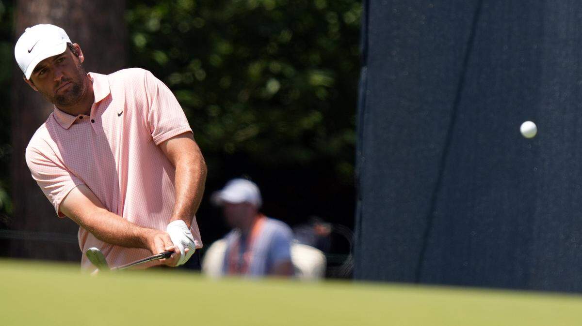 Scottie Scheffler chips up onto the second green during a practice round for the U.S. Open golf tournament at Pinehurst No. 2 on Monday.