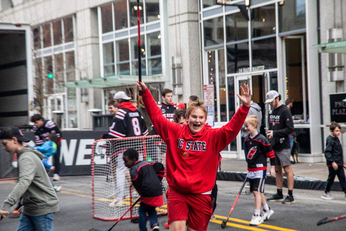 Children play street hockey with members of the N.C. State ice hockey team during the Carolina Hurricanes Fan Fest 2023, a free, all-day party on Fayetteville Street in downtown Raleigh Friday, Feb. 17, 2023.