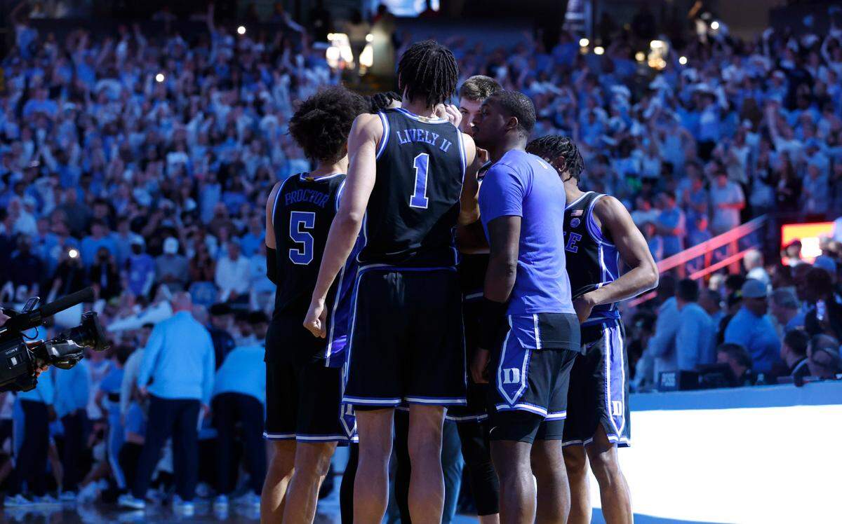 The Blue Devils huddle including Tyrese Proctor (5), Dereck Lively II (1), Kyle Filipowski (30), Dariq Whitehead (0) and Jeremy Roach (3) before UNC’s game against Duke at the Smith Center in Chapel Hill, N.C., Saturday, March 4, 2023.