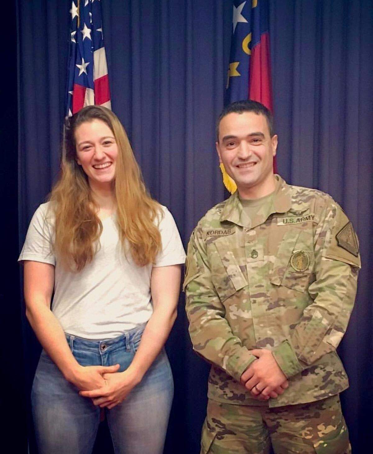 Capt. Rebecca Lobach, left, and now-Capt. Bilal Kordab pose December 2018 after Lobach took the oath of enlistment into the North Carolina Army National Guard in Raleigh, N.C. Lobach died while performing a training mission near Ronald Reagan Washington National Airport on Jan. 29.