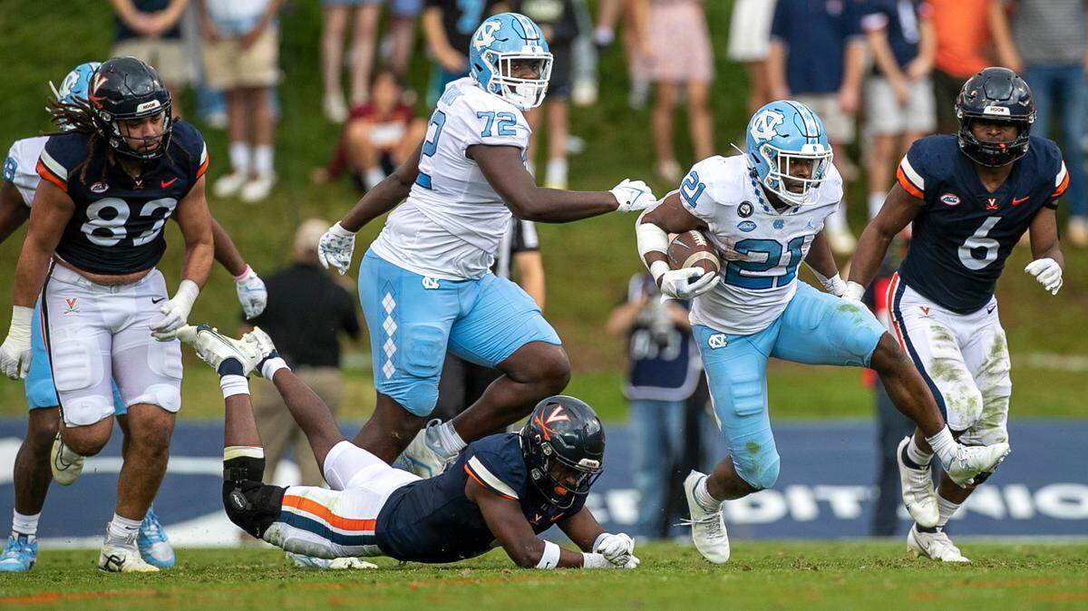 North Carolina’s Elijah Green (21) breaks open on a14-yard gain in the second quarter against Virginia on Saturday, November 5, 2022 at Scott Stadium in Charlottesville, Va.