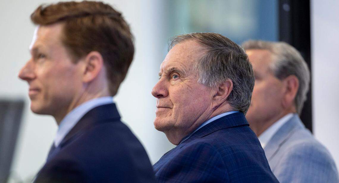 North Carolina coach Bill Belichick, flanked by UNC Chancellor Lee Roberts, listens to Lord Mayor Emma Blain, the Dublin Mayor during a press briefing on Wednesday, April 23, 2025 at Kenan Stadium in Chapel Hill, N.C. The Tar Heels will face TCU in the 2026 Aer Lingus College Football Classic on Saturday, August 29, 2026 at Aviva Stadium in Dublin, Ireland.