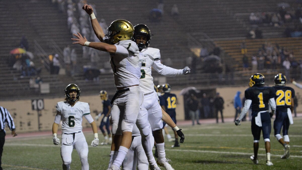 Ethan Hebb, left, of Cardinal Gibbons celebrates with his teammate Jacob Gill after scoring a touchdown against Northern Durham  on November 9, 2018.