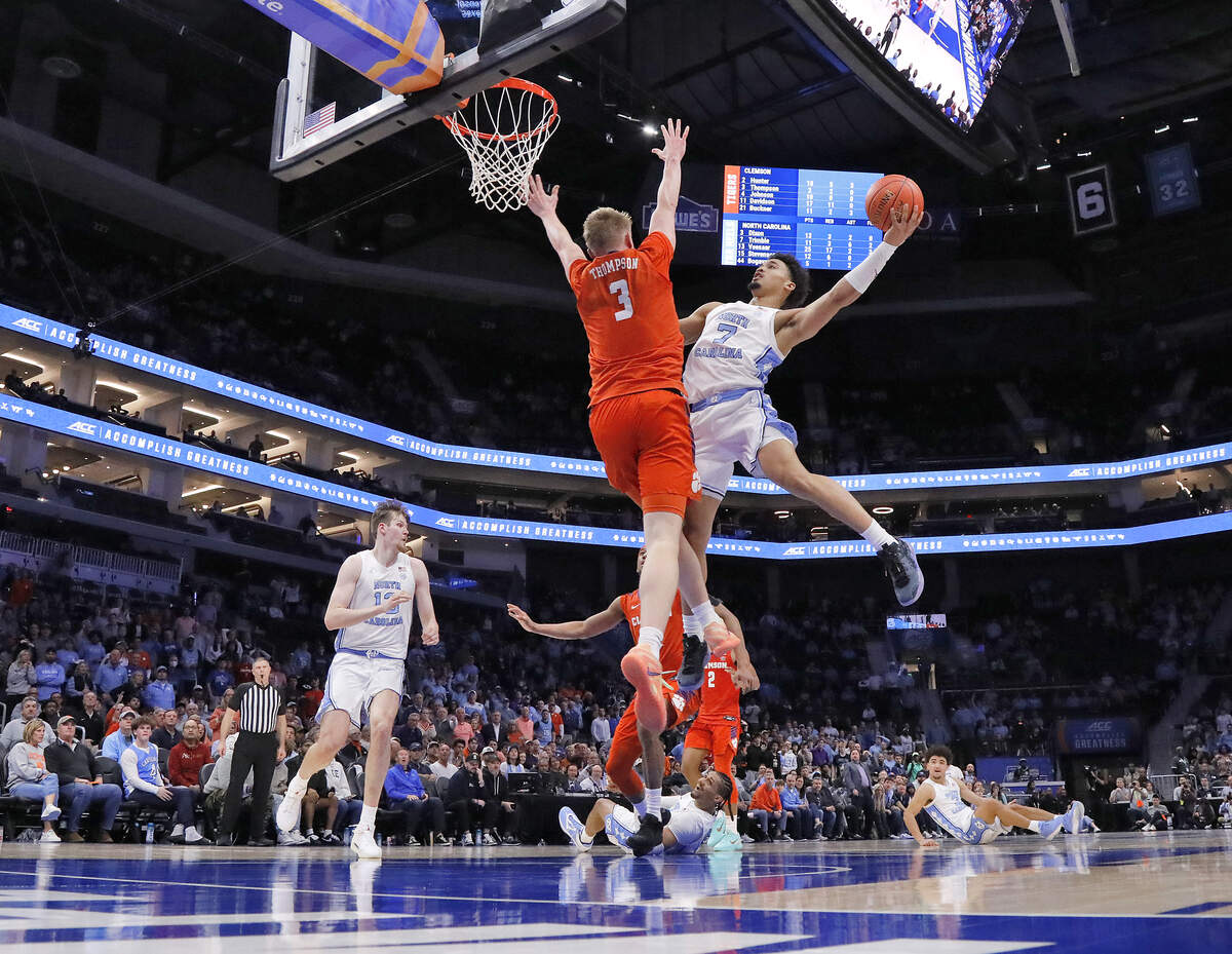 North Carolina's Seth Trimble drives to the basket against Clemson's Chase Thompson late in the second half of the Tar Heels’ 80-79 loss in the ACC Tournament quarterfinals on Thursday, March 12, 2026, at the Spectrum Center in Charlotte, N.C.