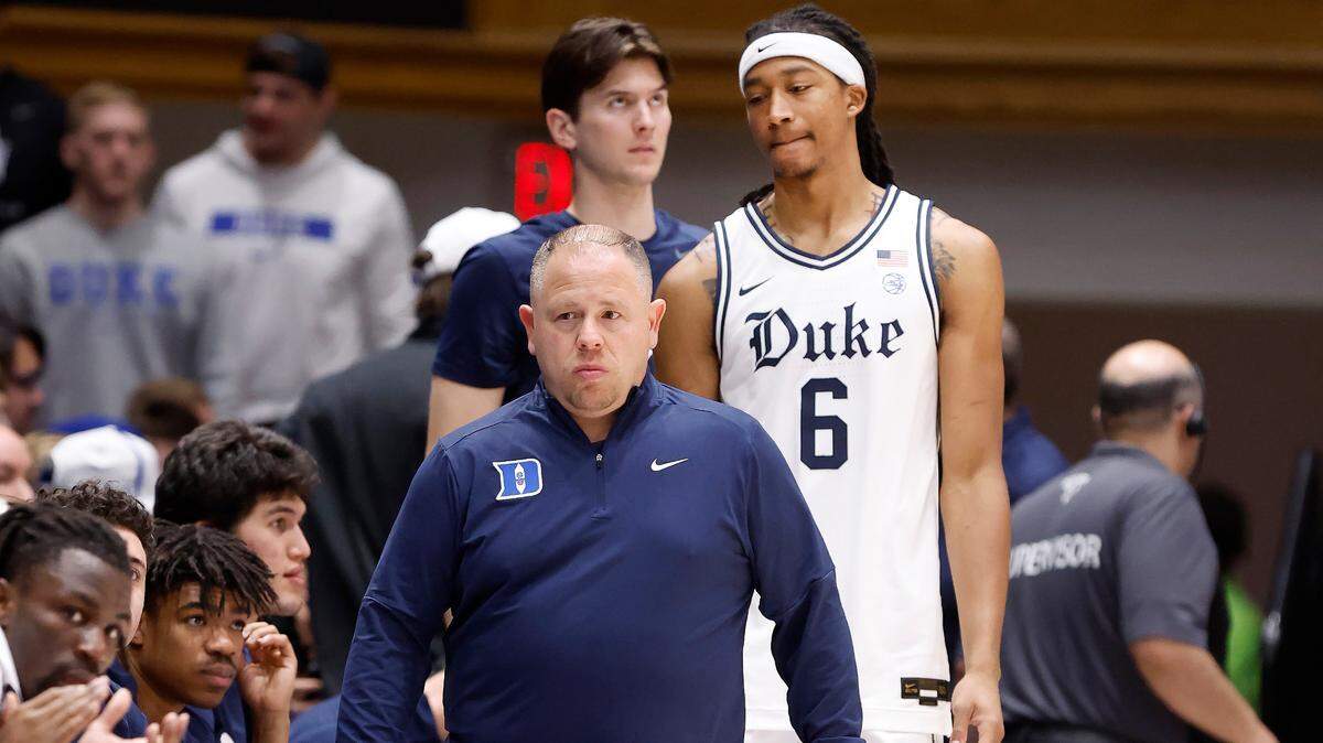 Duke’s Maliq Brown (6) walks back to the bench with Jose Fonseca, head men’s basketball trainer, during the first half of Duke’s game against Notre Dame at Cameron Indoor Stadium in Durham, N.C., Saturday, Jan. 11, 2025. Brown would not return to the game.