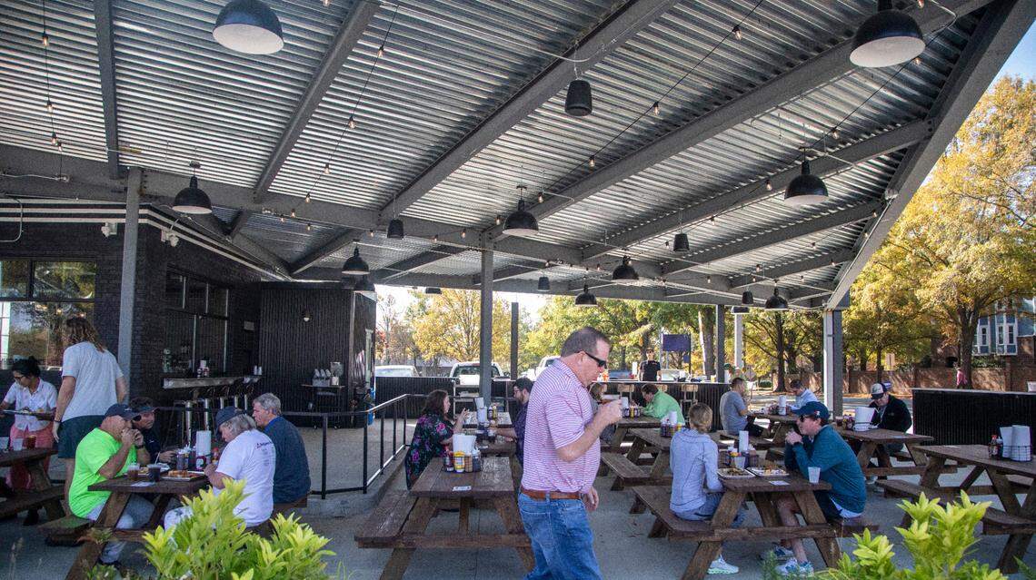 Customers dine during the opening of Longleaf Swine in Raleigh Friday, Nov. 4, 2022.