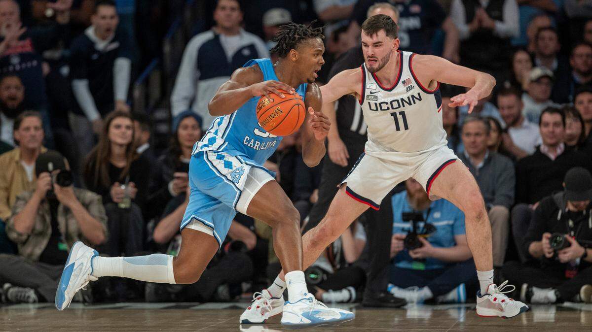 North Carolina’s Harrison Ingram (55) drives against Connecticut’s Alex Karaban (11) during the first half in the Jimmy V Classic on Tuesday, December 5, 2023 at Madison Square Garden in New York, NY.