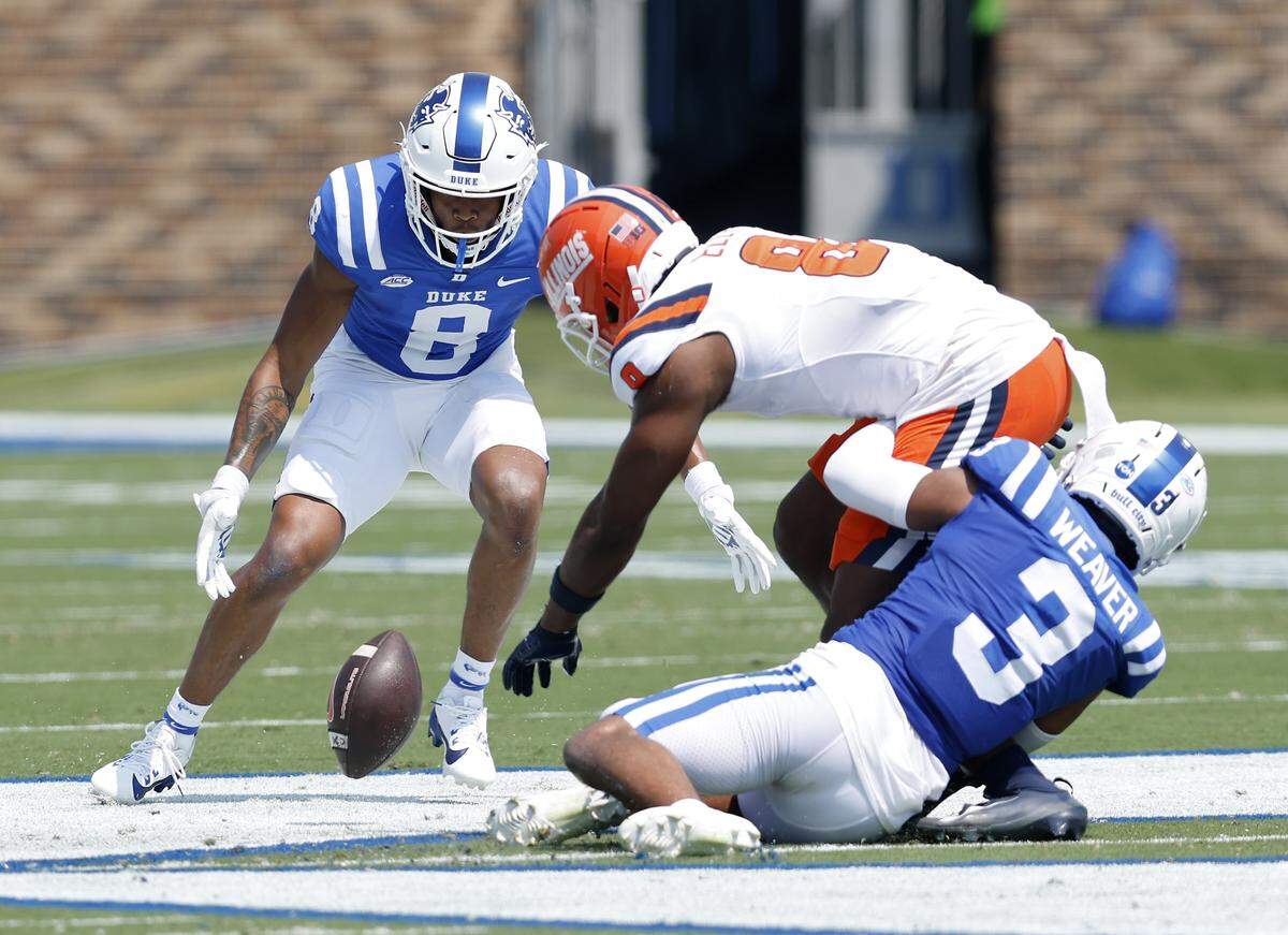 Duke’s DaShawn Stone and Caleb Weaver pressure Illinois wide receiver Malik Elzy during the first half of the Blue Devils’ 45-19 loss on Saturday, Sept. 6, 2025, at Wallace Wade Stadium in Durham, N.C.