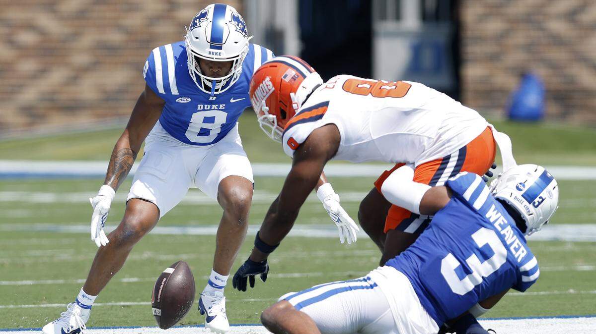 Duke’s DaShawn Stone and Caleb Weaver pressure Illinois wide receiver Malik Elzy during the first half of the Blue Devils’ 45-19 loss on Saturday, Sept. 6, 2025, at Wallace Wade Stadium in Durham, N.C.