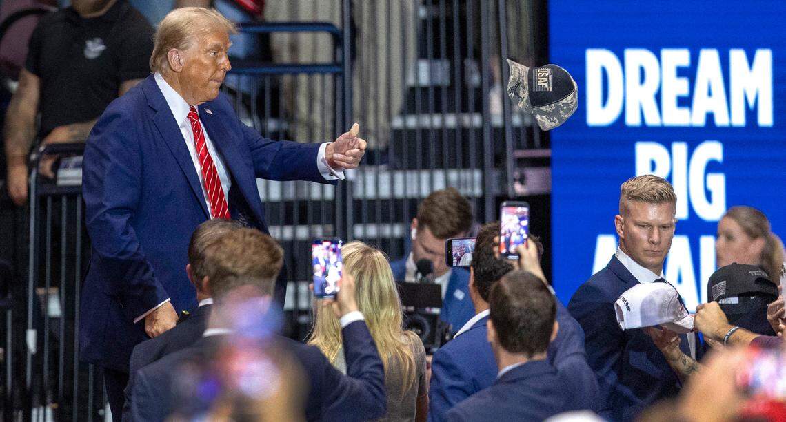 Republican presidential nominee, former President Donald Trump, tosses a hat to a supporter after autographing it, following his remarks on Wednesday, October 30, 2024 at the Rocky Mount Event Center in Rocky Mount, N.C.