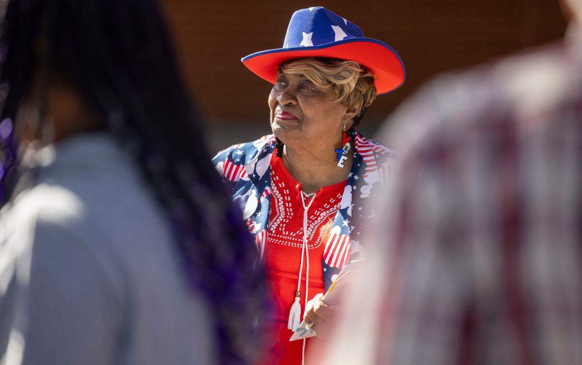 Virginia Tally, dressed in her patriotic colors, canvasses for the Democratic Party, greeting voters at the Southeast Raleigh Magnet High School voting site on Tuesday, November 5, 2024 in Raleigh, N.C.