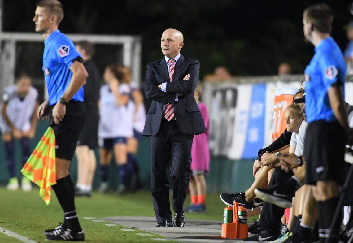 North Carolina Courage head coach Paul Riley, center, watches from the sideline of a 2017 soccer game.