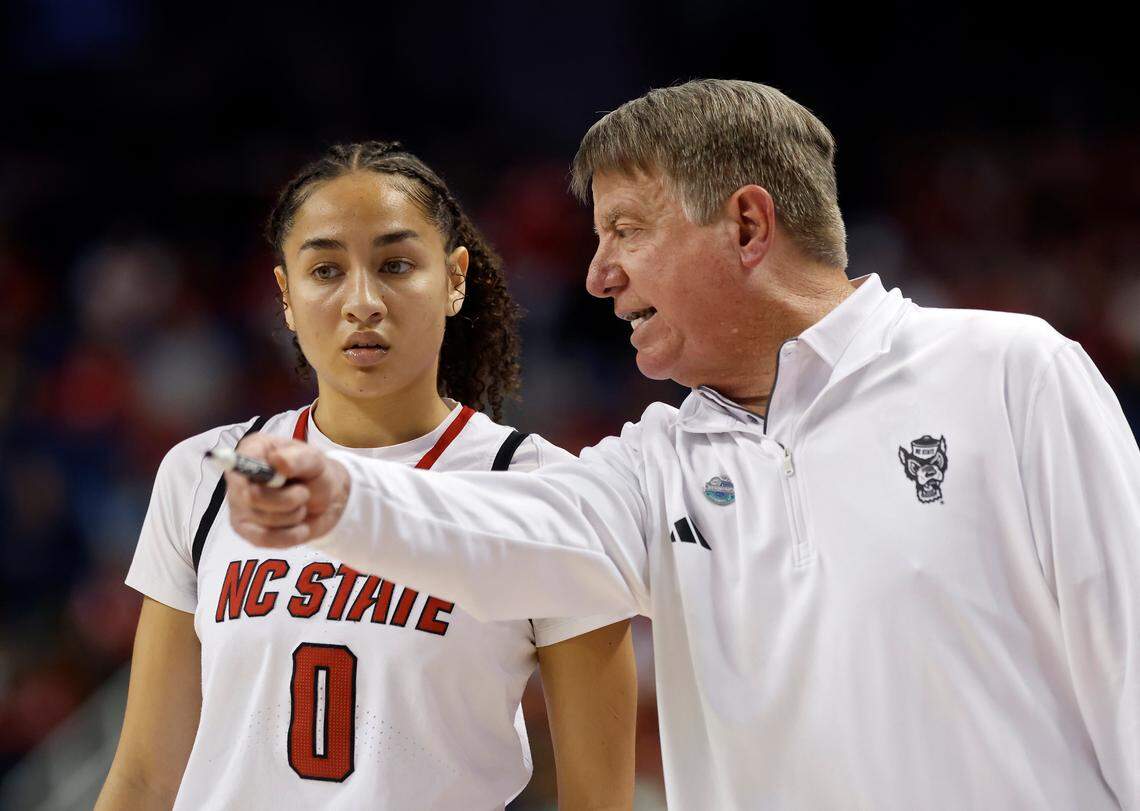 N.C. State’s Devyn Quigley talks with head coach Wes Moore during the second half of the Wolfpack’s 76-62 loss to Duke in the ACC Tournament final on Sunday, March 9, 2025, at First Horizon Coliseum in Greensboro, N.C.