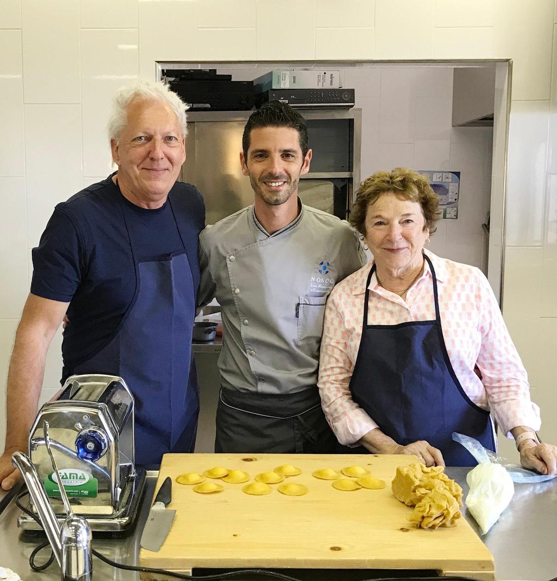 Ed and Frances Mayes with Chef Giovanni Galesi, center, at Nosco cooking school in Ragusa Sicily. Mayes and her husband, Ed, explore Italy from north to south, eating, drinking and soaking up the culture in her new book, “See You in the Piazza.”