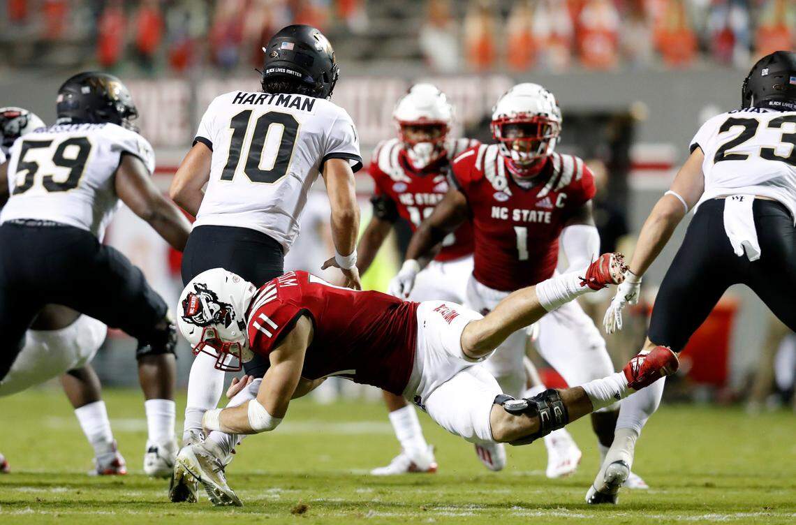 N.C. State linebacker Payton Wilson (11) sacks Wake Forest quarterback Sam Hartman (10) during the second half of N.C. State’s 45-42 victory over Wake Forest at Carter-Finley Stadium in Raleigh, N.C, Saturday, Sept. 19, 2020.