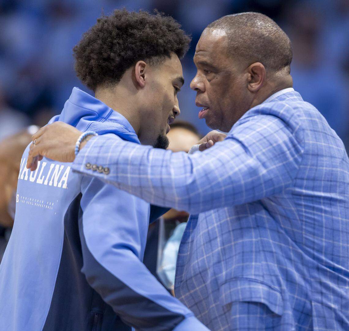 North Carolina guard Seth Trimble (7) embraces coach Hubert Davis on ‘Senior Night’, prior to playing his final home game against Clemson on Tuesday, March 3, 2026 at the Smith Center in Chapel Hill, N.C.