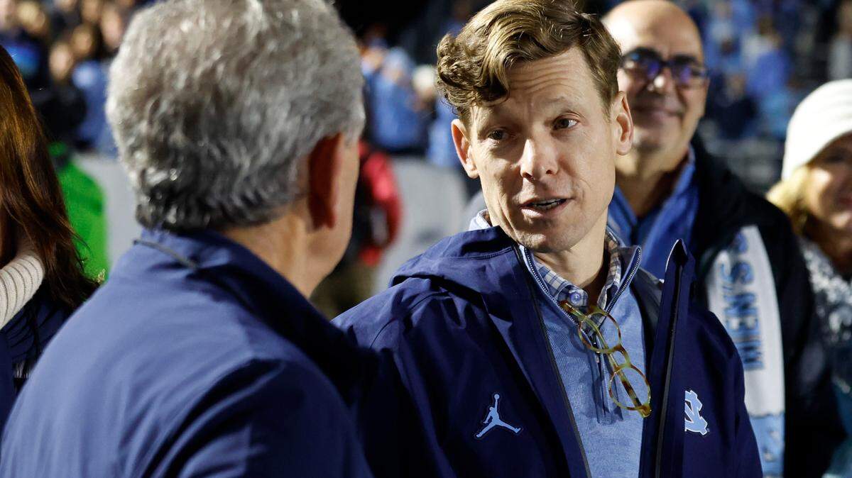 UNC-Chapel Hill Chancellor Lee Roberts talks with athletics director Bubba Cunningham after UNC’s 1-0 victory over Wake Forest in the finals of the 2024 Women’s College Cup at WakeMed Soccer Park in Cary, N.C., Monday, Dec. 9, 2024.