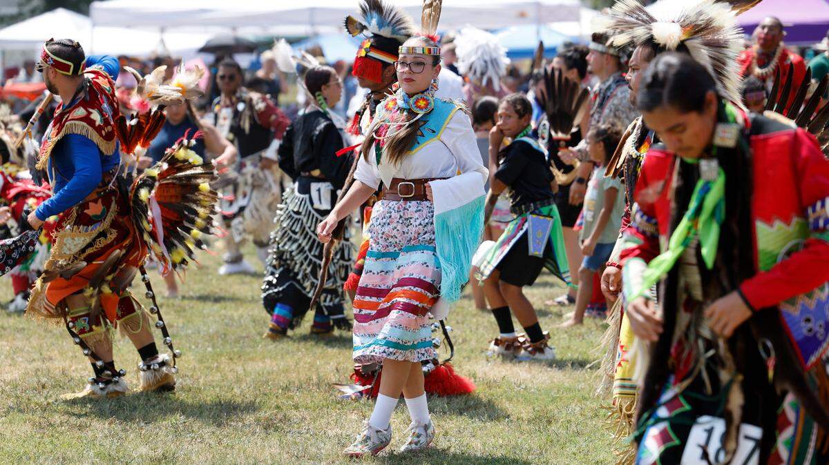 Attendees participate in a blanket dance during the Dix Park Inter-Tribal Pow Wow in Raleigh, N.C., Saturday, August 26, 2023.