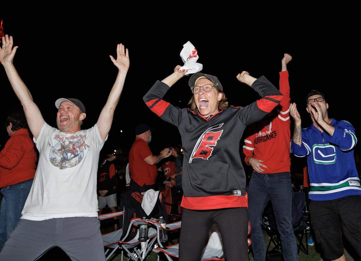 Fans at a watch party at Moore Square react following a Carolina Hurricanes goal in the third period of Game 2 of the Stanley Cup Final against the Vegas Golden Knights on Thursday, June 4, 2026. 