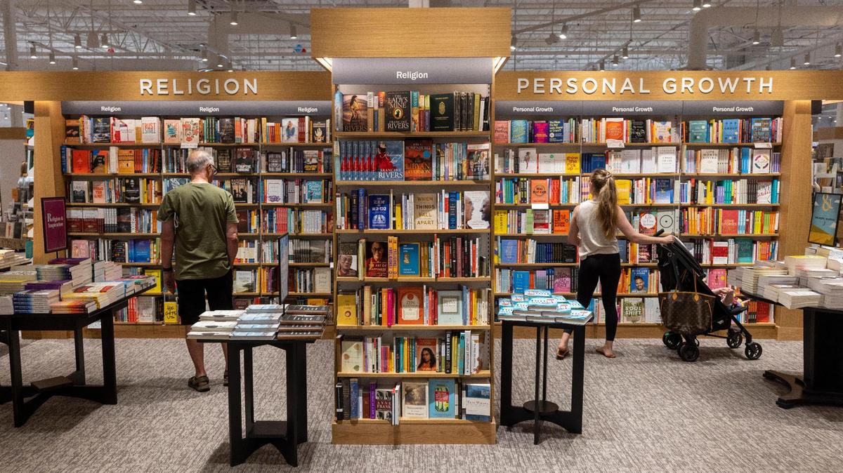 Shoppers browse for titles in the religion and personal growth sections at the new Barnes & Noble store which opened in the Shoppes of Kildare at 1311 Kildaire Farm Road on Wednesday, July 5, 2023 in Cary, N.C.