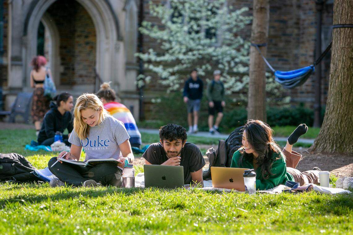 From left, Elsie Gotham, first-year; Ansh Amin, first-year; and Cheryl Li, sophomore, study together on the Abele Quad during a gorgeous spring afternoon.