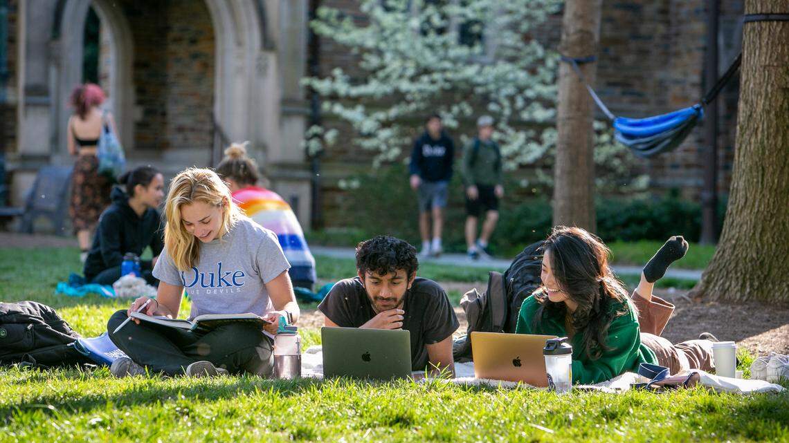 From left, Elsie Gotham, first-year; Ansh Amin, first-year; and Cheryl Li, sophomore, study together on the Abele Quad during a gorgeous spring afternoon.