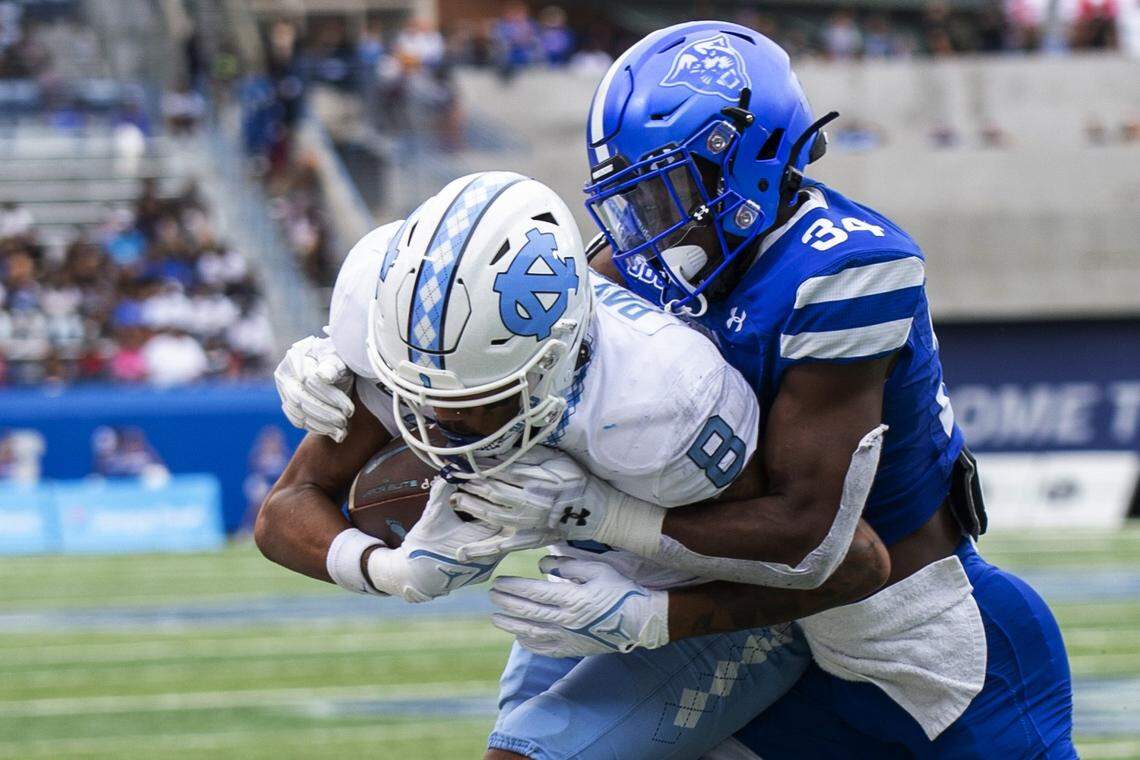Georgia State safety Antavious Lane tackles North Carolina wide receiver Kobe Paysour in the second half of an NCAA college football game Saturday, Sept. 10, 2022, in Atlanta.