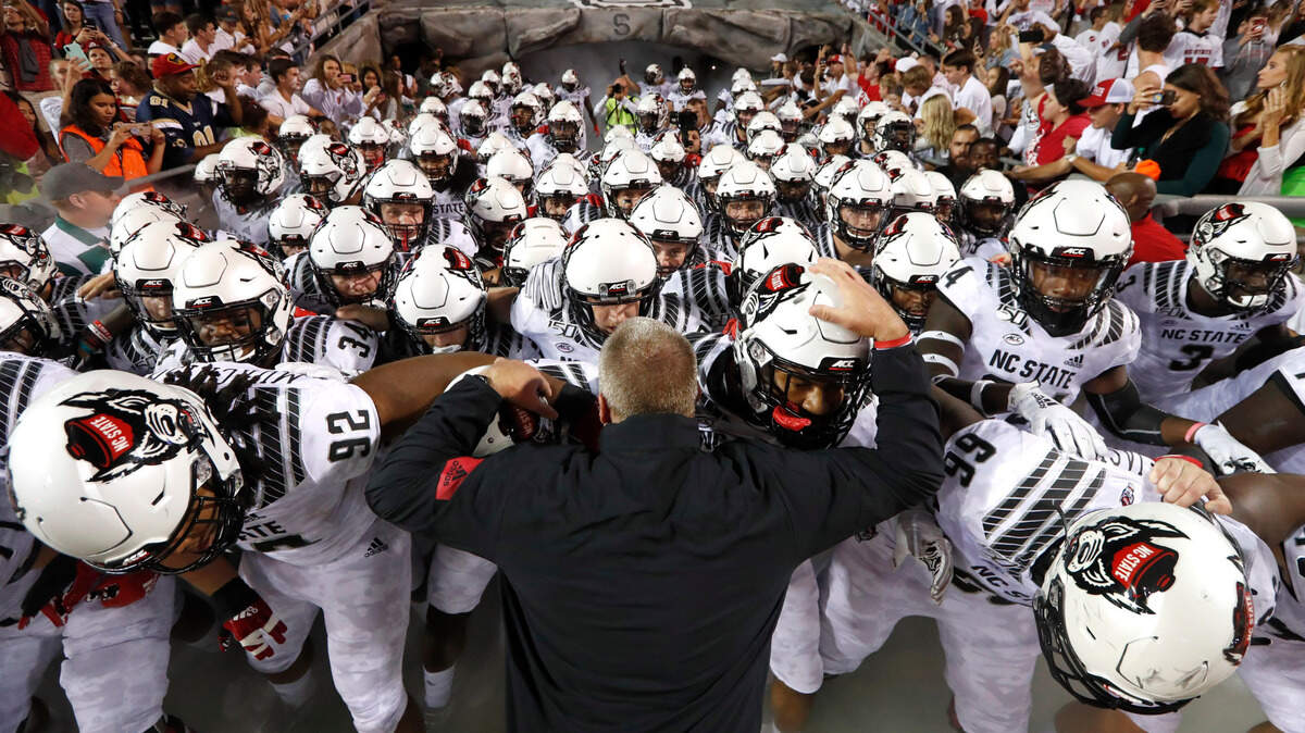 N.C. State head coach Dave Doeren prepares to lead the team onto the field before N.C. State’s game against Syracuse at Carter-Finley Stadium in Raleigh, N.C., Thursday, Oct. 10, 2019.