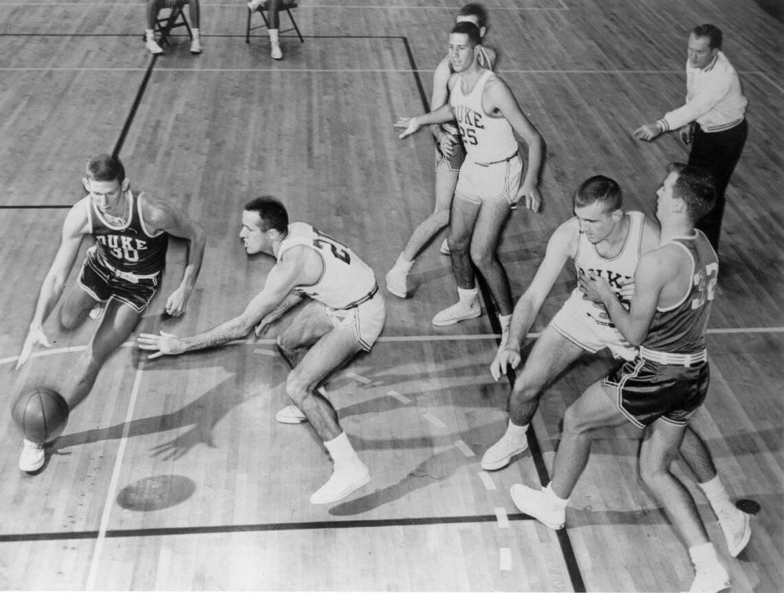 Duke head coach Vic Bubas, upper right, leads a practice in the early 1960s.