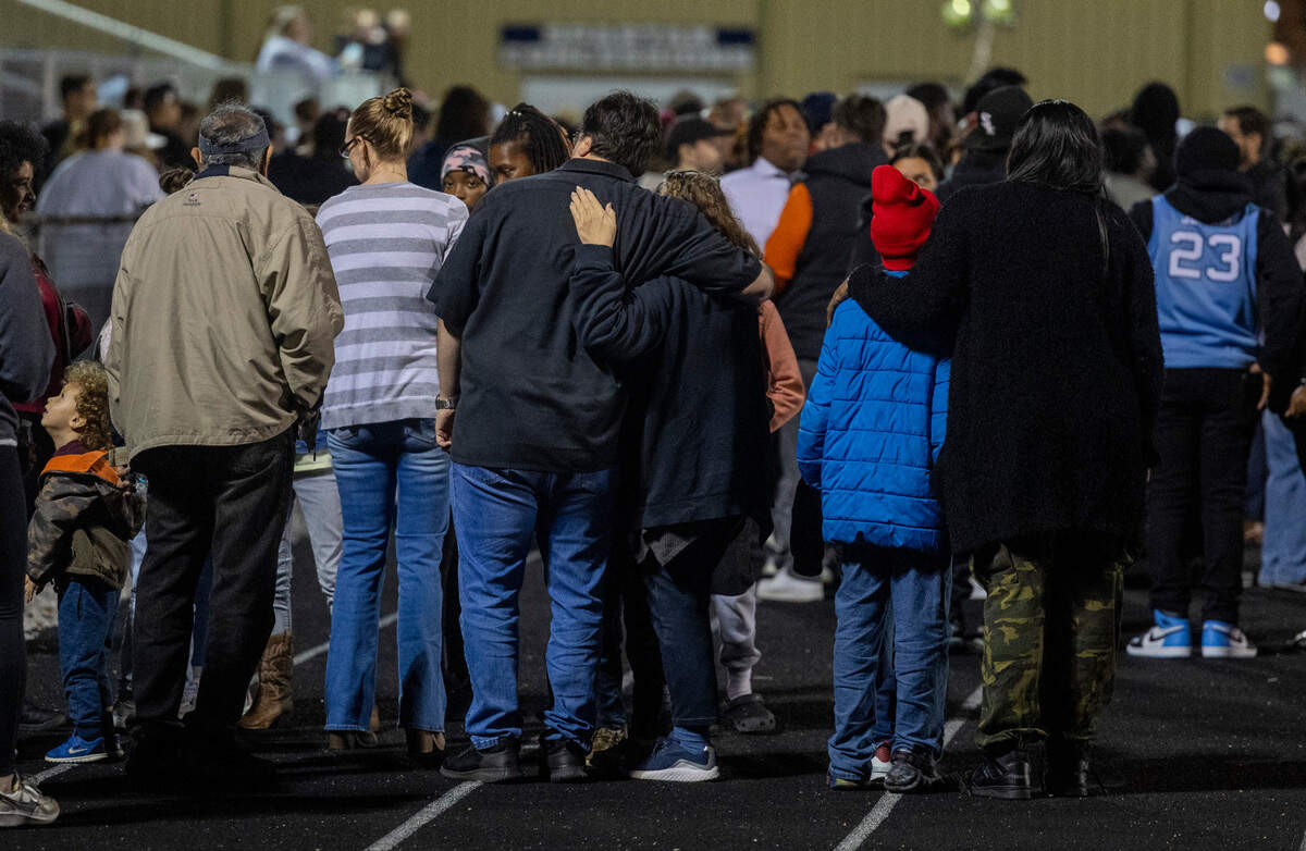 Mourners rgather at the conclusion of a vigil Wednesday, Jan. 24, 2024 on the track of Charles T. Tucker Stadium at Smithfield-Selma High School in Johnston County. Five Smithfield-Selma students were memorialized including four boys who died in a car wreck early Monday morning.
