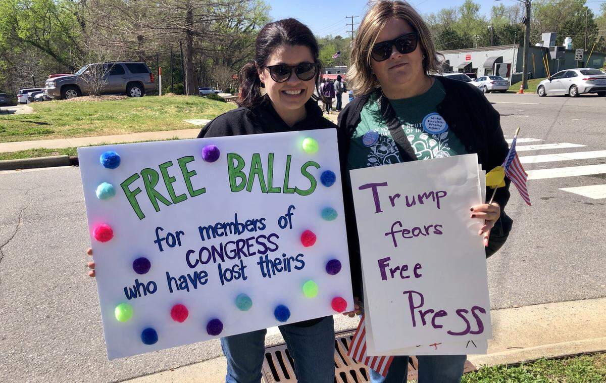 Tiffany Bashore of Cary, left, at the No Kings rally in Pittsboro with her friend Kara Johnson of Chatham County