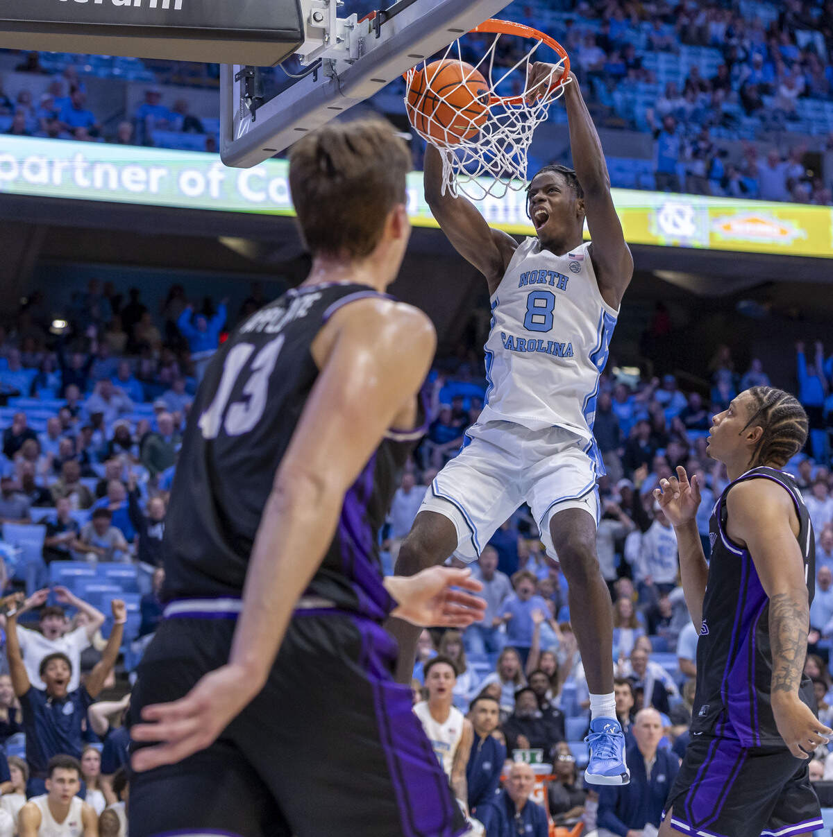 North Carolina forward Caleb Wilson (8) dunks over Central Arkansas guard Javion Guy-King (2) in the second half on Monday, November 3, 2025 at the Smith Center in Chapel Hill, N.C.