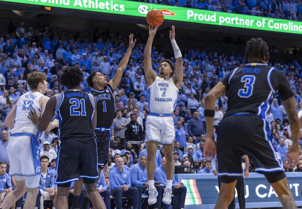 North Carolina guard Seth Trimble (7) puts up a shot against Duke guard Caleb Foster (1) in the second half on Saturday, February 7, 2026 at the Smith Center in Chapel Hill, N.C.