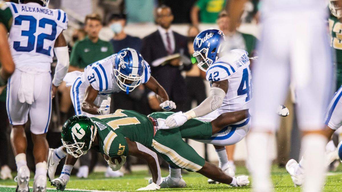 Charlotte 49ers wide receiver, Grant DuBose, bottom center, falls into the end zone to score a touchdown against Duke during a game at Jerry Richardson Stadium on Friday, September 3, 2021 in Charlotte, NC.