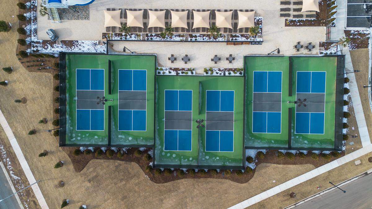 An aerial of six pickleball courts at the new Life Time at Alston Town Center in West Cary.