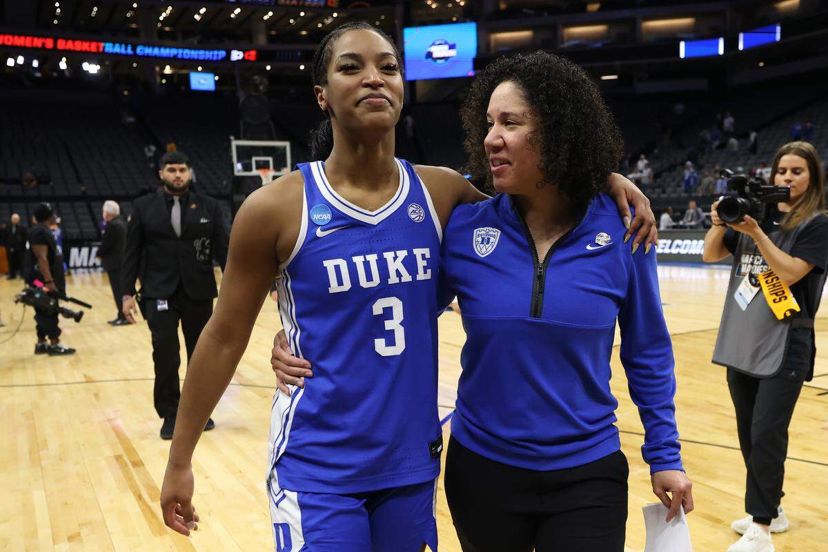Duke head coach Kara Lawson celebrates with Ashlon Jackson after the Blue devils downed LSU on Jackson’s buzzer-beater 3-pointer at the end of the teams’ 2026 NCAA Women’s Basketball Tournament Sweet 16 game at Golden 1 Center on March 27, 2026 in Sacramento, California.