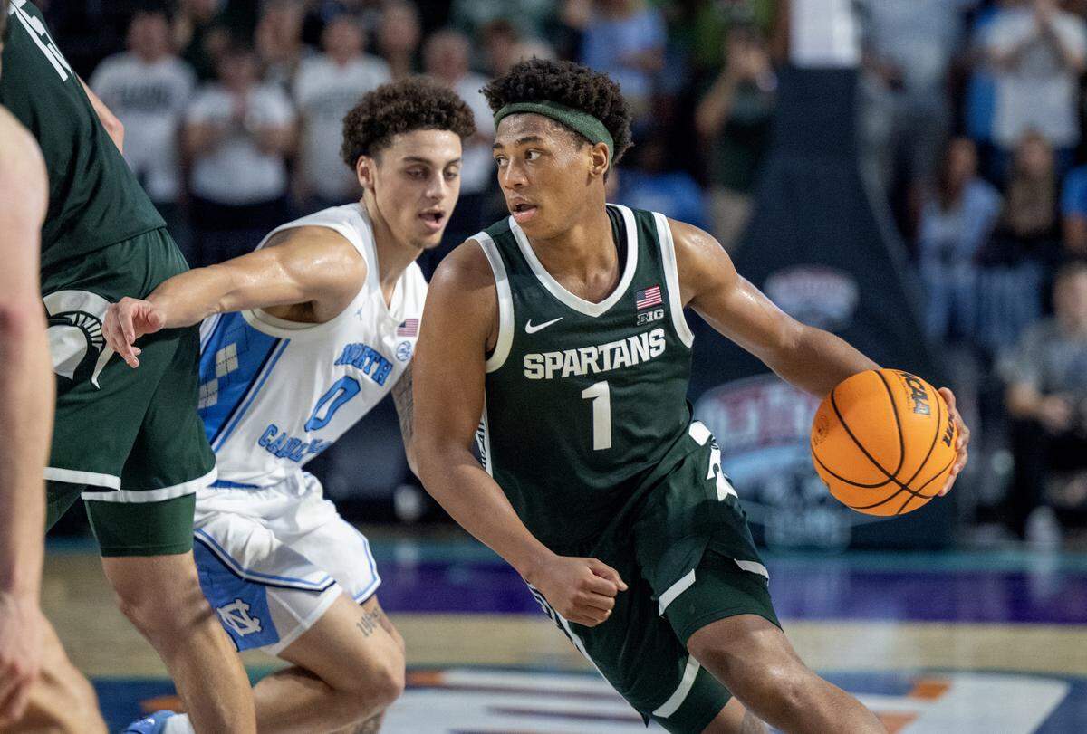 Michigan State’s Jeremy Fears Jr. drives against UNC’s Kyan Evans. 