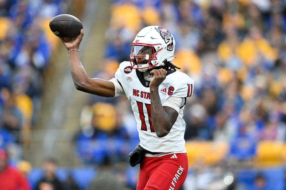 NC State’s CJ Bailey passes during the second quarter against the Pittsburgh Panthers on Oct. 25, 2025 in Pittsburgh. 