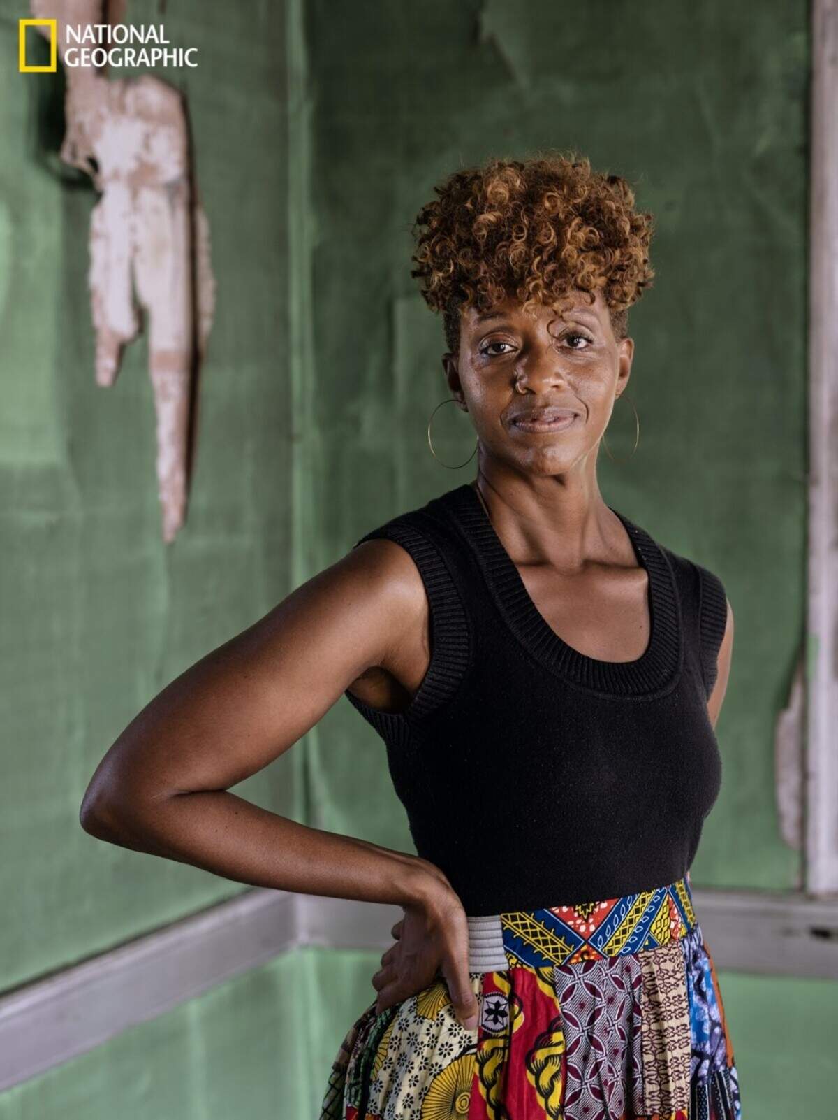 National Geographic Explorer Tara Roberts stands for a portrait at her grandfather’s abandoned home in Edenton, NC, on June 13, 2021. Roberts became the first Black woman National Geographic Explorer to be featured on the cover of the magazine. The cover story, along with a six-episode podcast called “Into the Depths,” is the culmination of about four years spent researching and scuba diving alongside members of a non-profit organization called Diving with a Purpose (DWP).&nbsp;